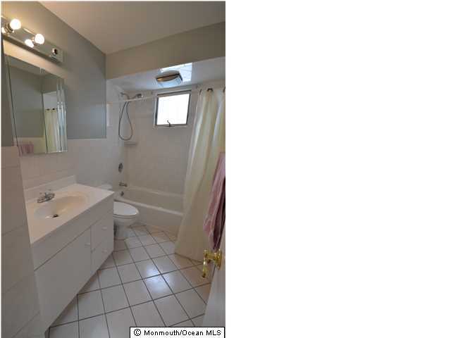 955 Hyson Road Jackson, NJ 08527 - Photo 9 of 15 a bathroom with a toilet sink and mirror