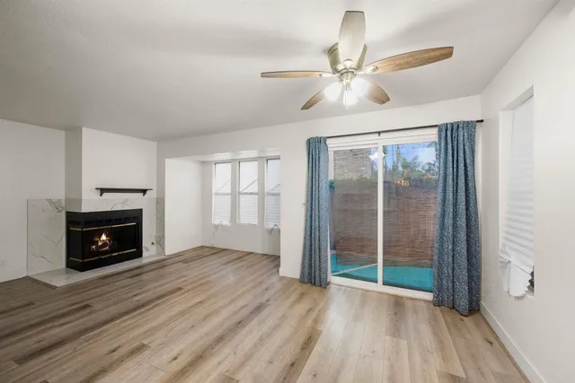 a view of livingroom with hardwood floor and a ceiling fan