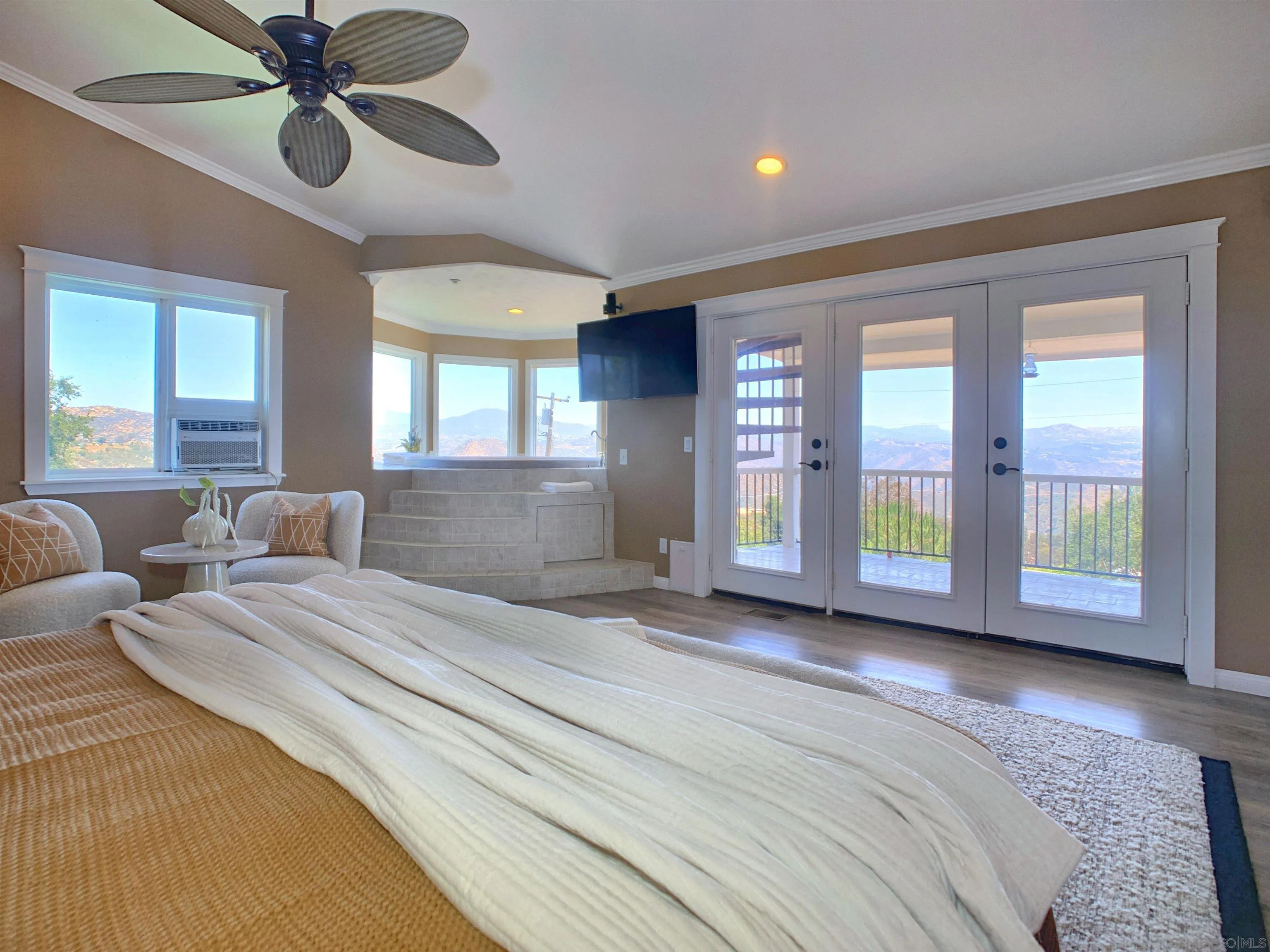 205 Highline Trail El Cajon, CA 92021 - Photo 25 of 45 a spacious bedroom with a large bed and a large window