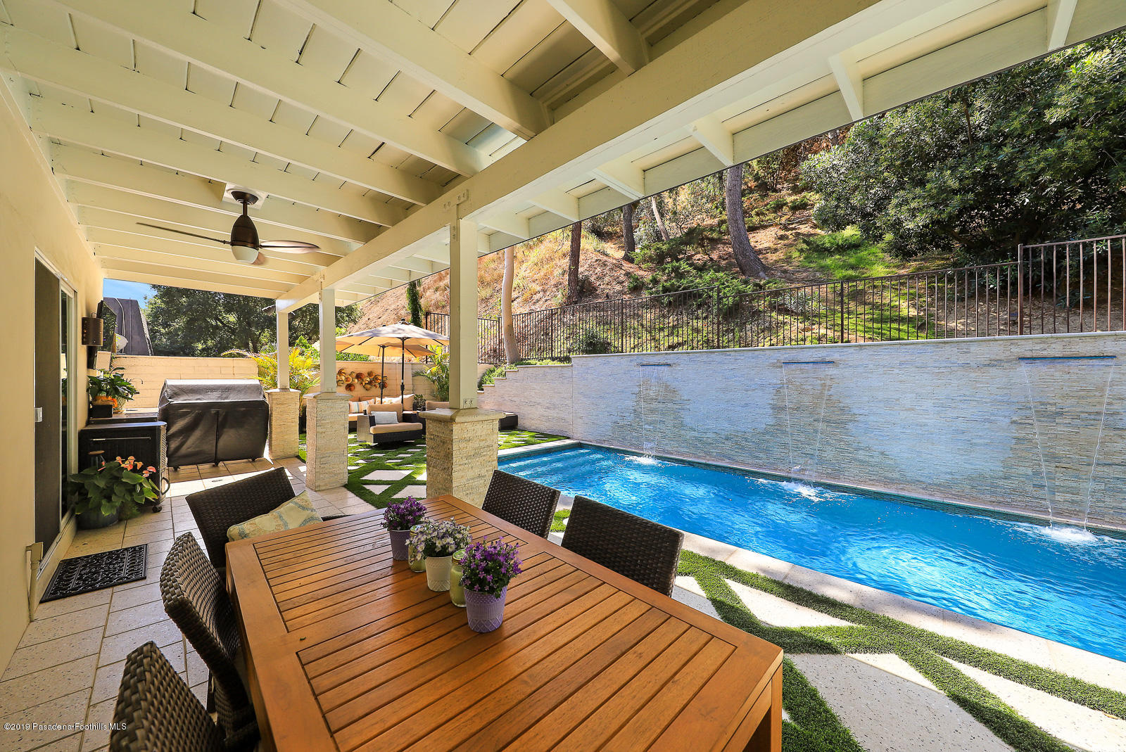 1412 Hillside Drive Glendale, CA 91208 - Photo 32 of 33 a living room with lots of furniture and a rug