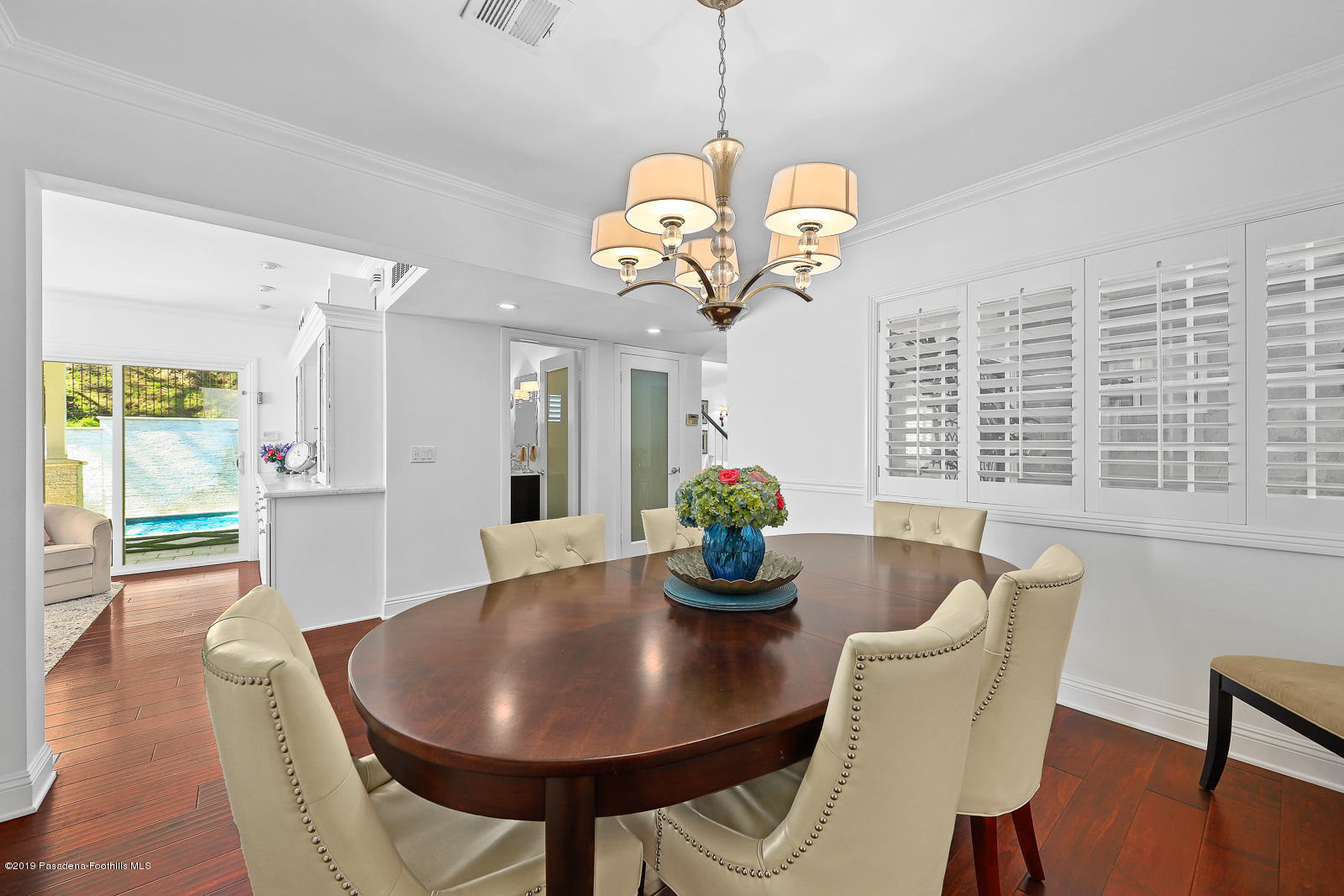 1412 Hillside Drive Glendale, CA 91208 - Photo 9 of 33 a view of a dining room with furniture a chandelier and wooden floor