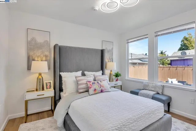 a bathroom with a sink mirror vanity and toilet