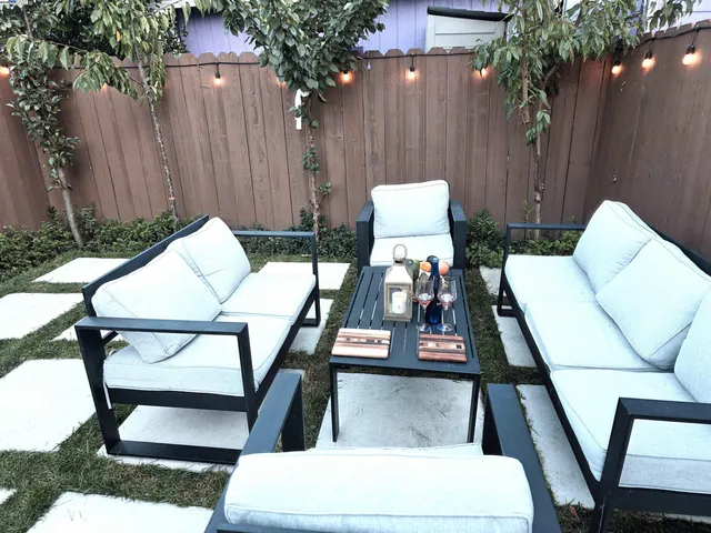 a view of an outdoor sitting area with furniture