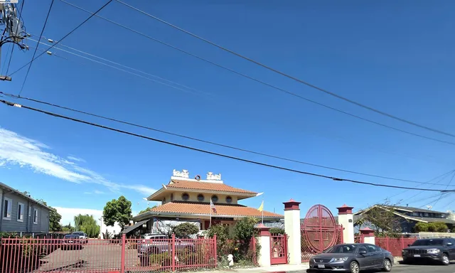 a front view of a residential apartment building with a yard