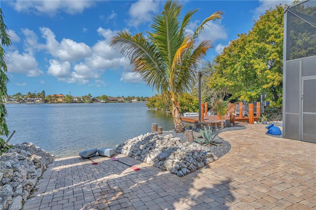 3001 50th Street Southwest Naples, FL 34116 - Photo 29 of 46 a view of a lake with a sitting space