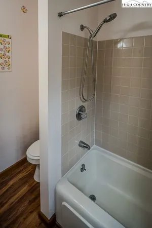 a bathroom with a shower and a toilet