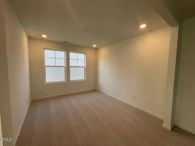 a kitchen with a sink and chandelier