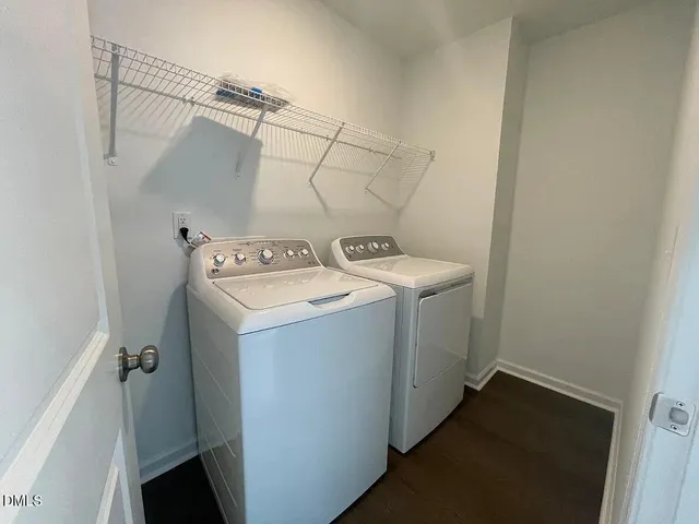a bathroom with double sink and a mirror