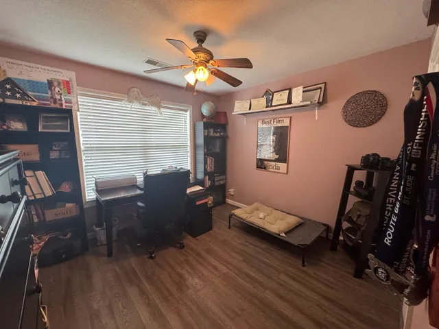 a bedroom with furniture and a window