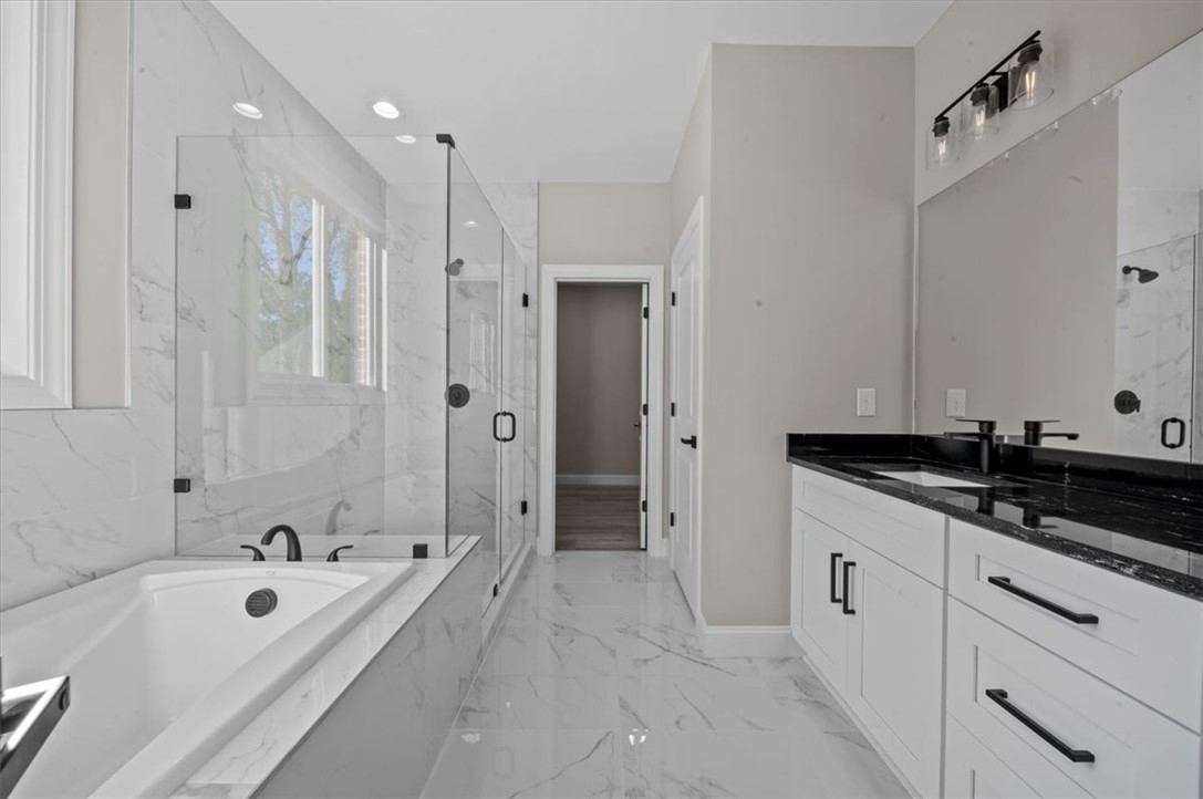 105 Bree Drive Anderson, SC 29621 - Photo 20 of 48 Luxurious bathroom with a spacious soaking tub and a sleek dual vanity, creating a serene personal retreat.