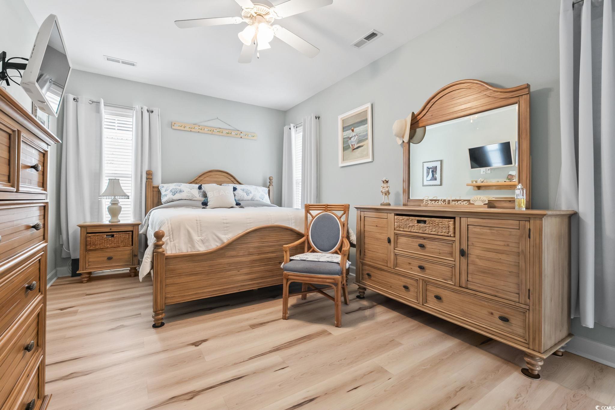 173 Foxpath Loop Myrtle Beach, SC 29588 - Photo 11 of 31 Bedroom with light wood-type flooring and a ceiling fan