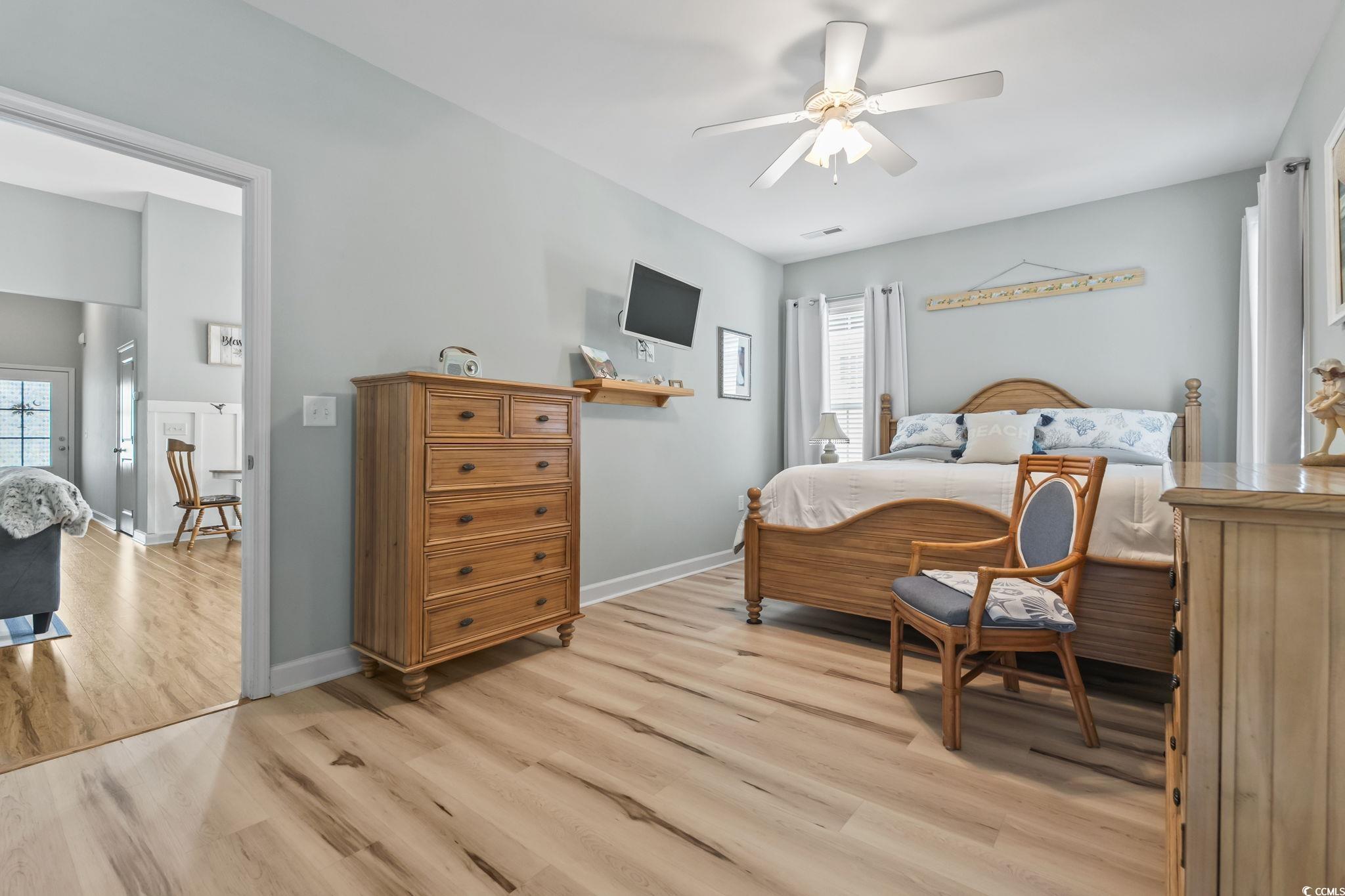 173 Foxpath Loop Myrtle Beach, SC 29588 - Photo 12 of 31 Bedroom featuring light wood-style floors and ceiling fan