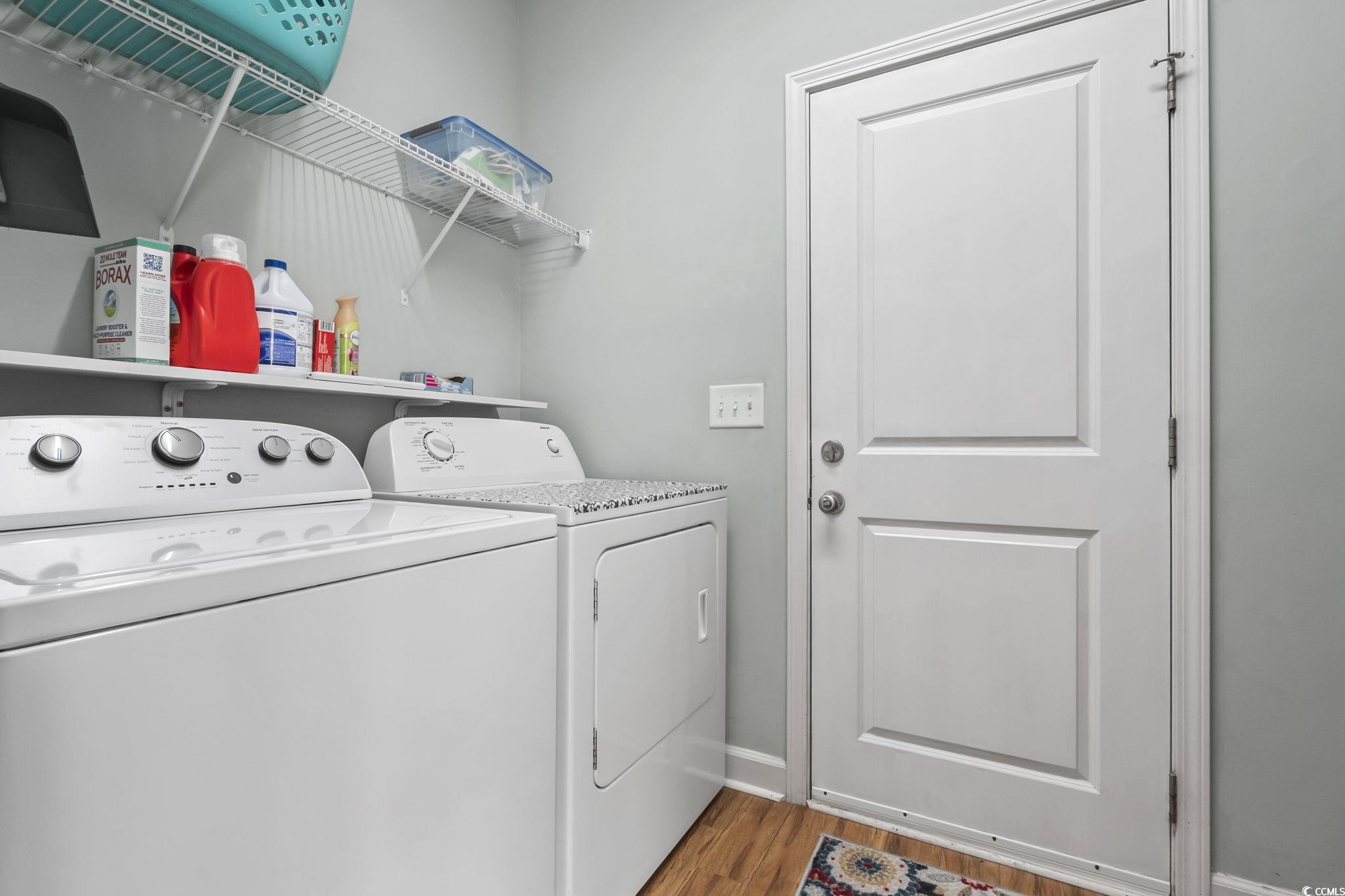 173 Foxpath Loop Myrtle Beach, SC 29588 - Photo 23 of 31 Laundry room with wood finished floors and washer and clothes dryer