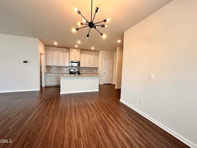 a view of kitchen with wooden floor and window