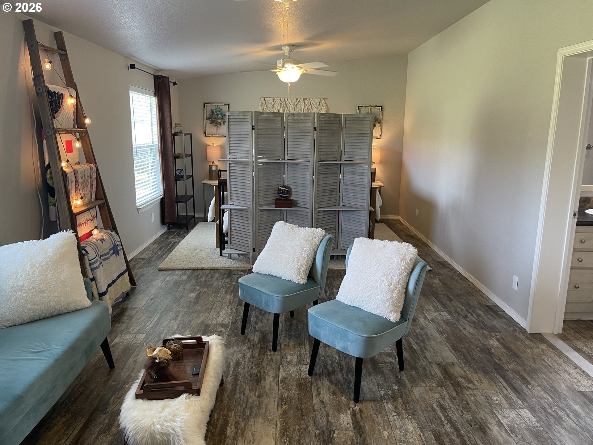 6404 Lookingglass Road Roseburg, OR 97471 - Photo 23 of 48 a living room with furniture and wooden floor