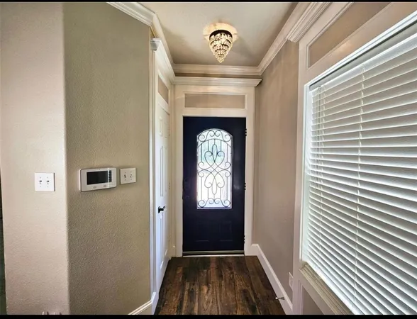 a view of entryway with wooden floor