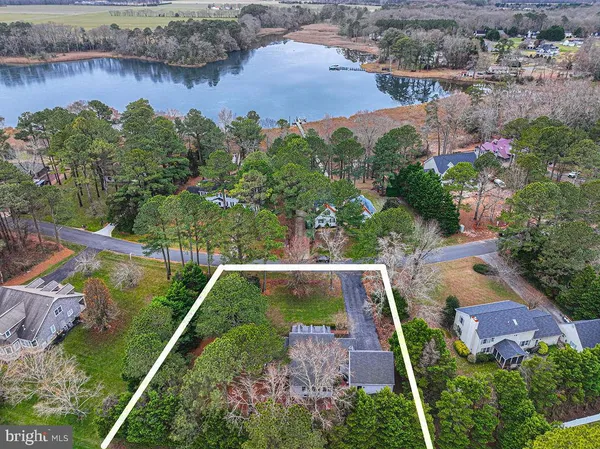 a living room with furniture and a painting on the wall