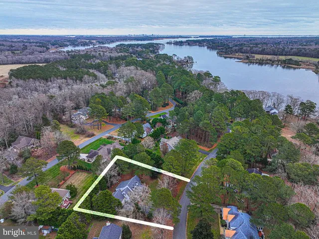 a kitchen with granite countertop a sink stove and refrigerator