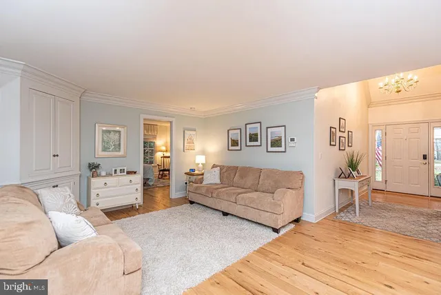 a dining room with furniture and a window