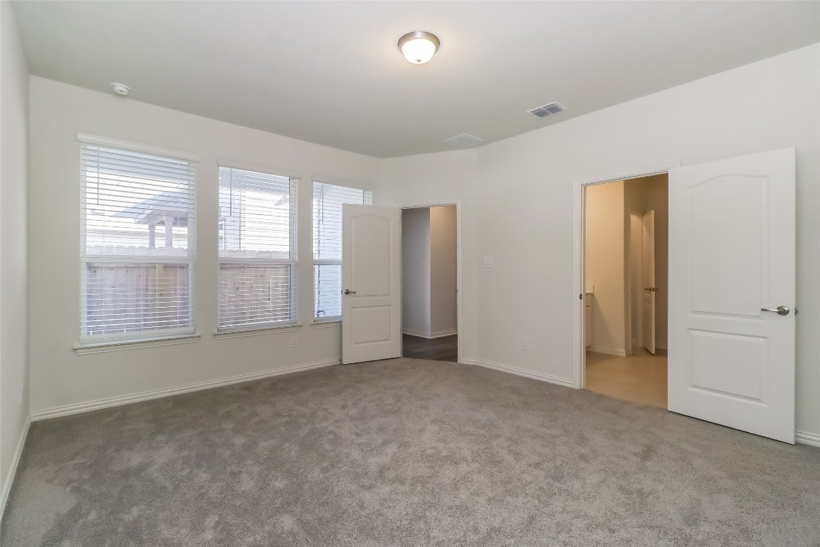 530 Ansley Court Taylor, TX 76574 - Photo 10 of 31 Unfurnished bedroom with carpet flooring and baseboards
