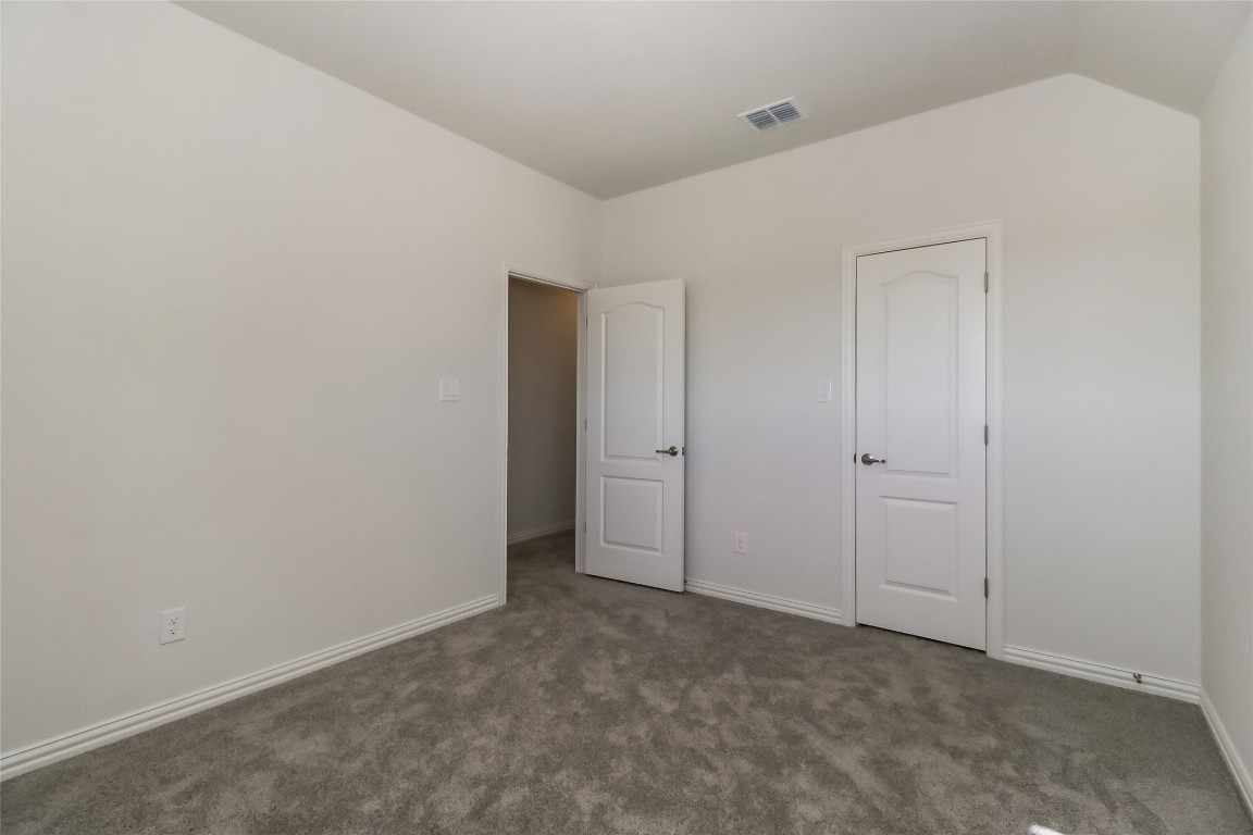 530 Ansley Court Taylor, TX 76574 - Photo 21 of 31 Unfurnished bedroom with carpet and baseboards
