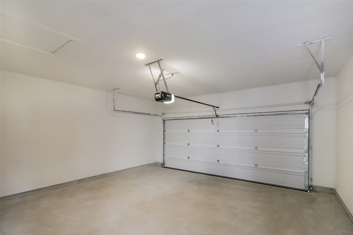 530 Ansley Court Taylor, TX 76574 - Photo 26 of 31 Garage featuring a garage door opener