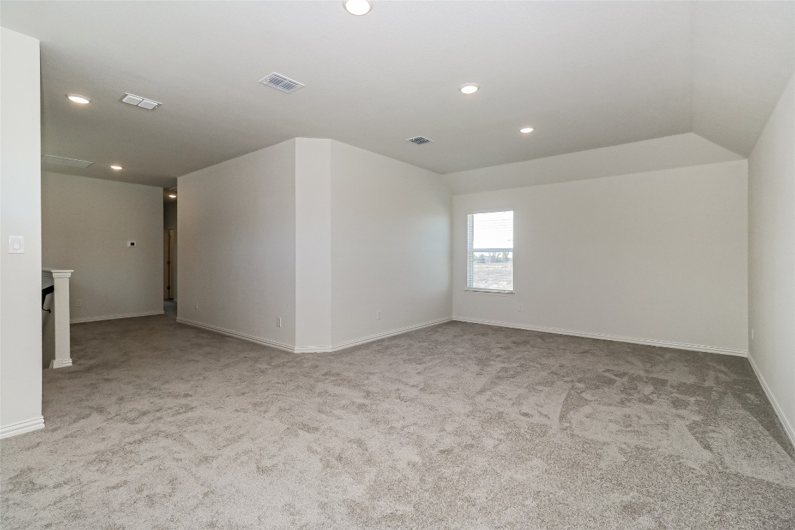 530 Ansley Court Taylor, TX 76574 - Photo 8 of 31 Unfurnished room with recessed lighting and light colored carpet