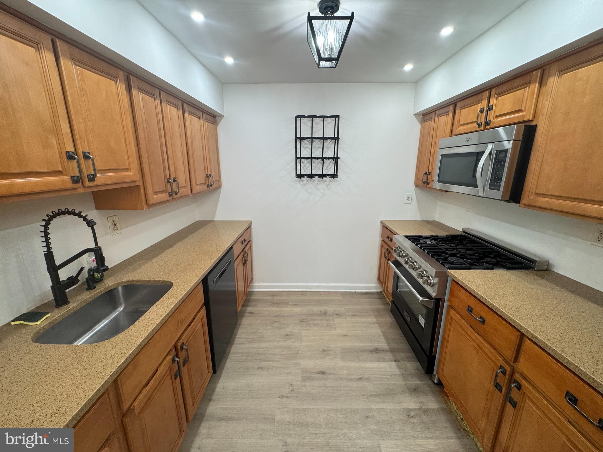 3125 Comly Road Philadelphia, PA 19154 - Photo 26 of 44 a kitchen with stainless steel appliances granite countertop a sink and a stove