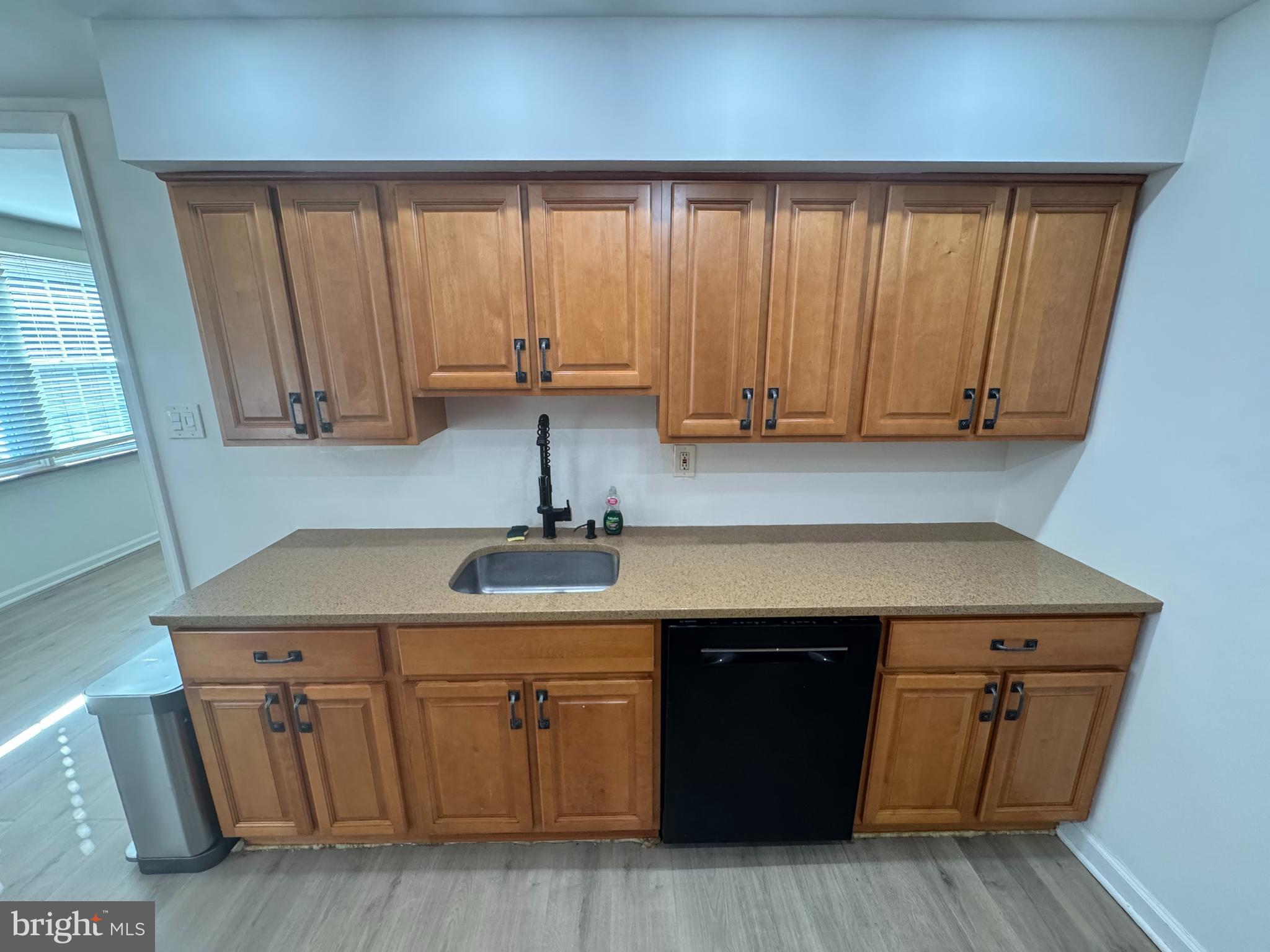 3125 Comly Road Philadelphia, PA 19154 - Photo 27 of 44 a kitchen with cabinets a sink and wooden floor