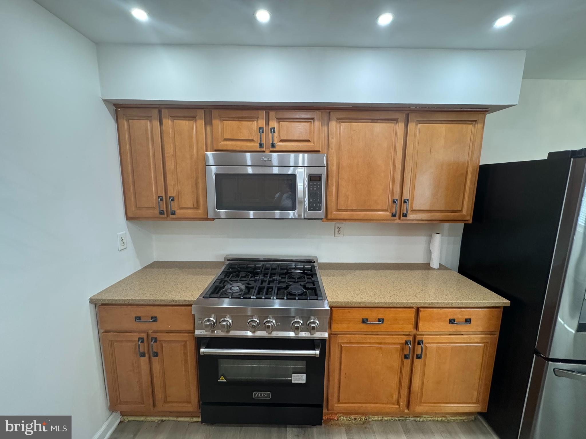 3125 Comly Road Philadelphia, PA 19154 - Photo 28 of 44 a kitchen with a stove and a microwave