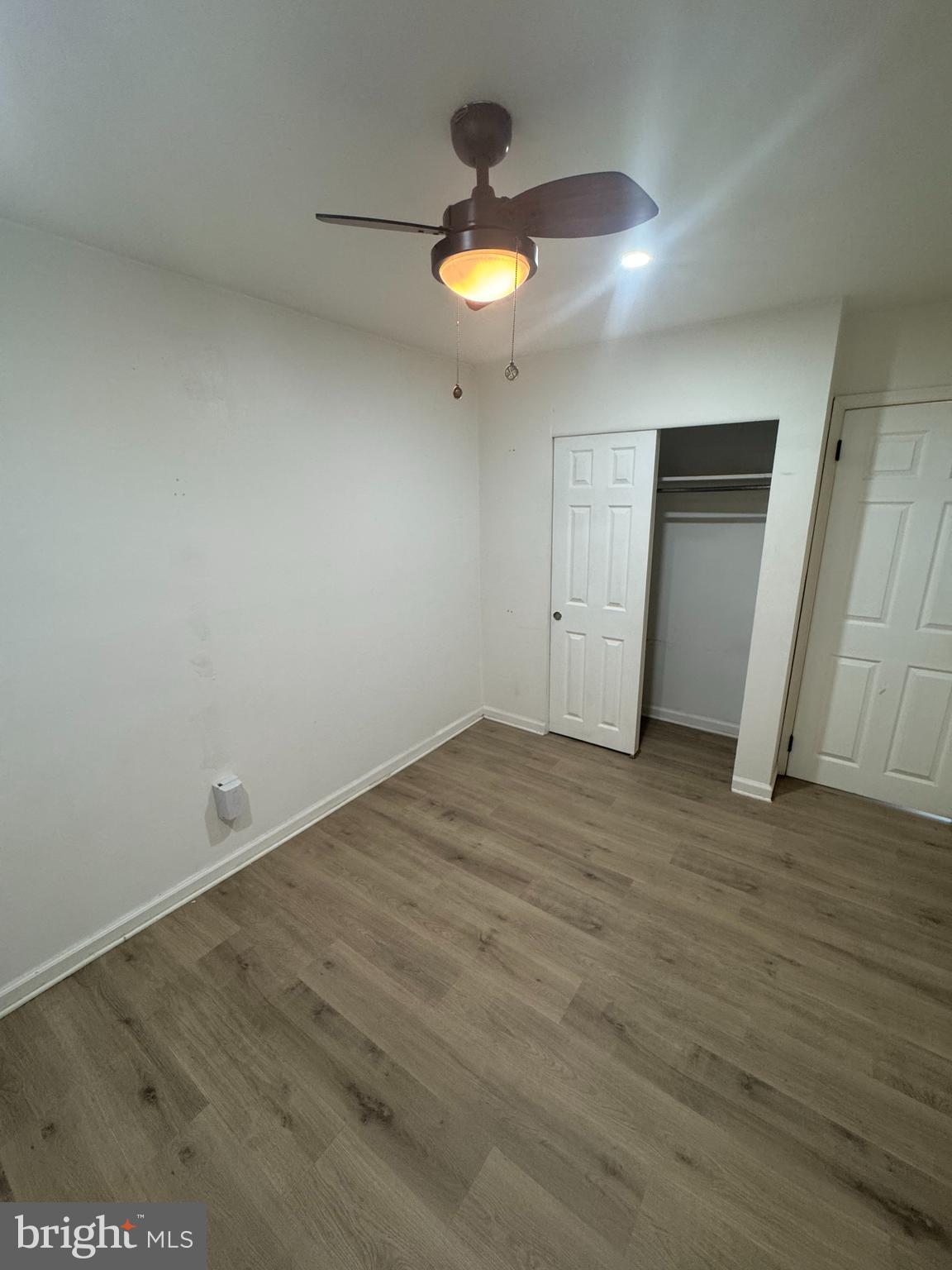 3125 Comly Road Philadelphia, PA 19154 - Photo 37 of 44 an empty room with wooden floor and window