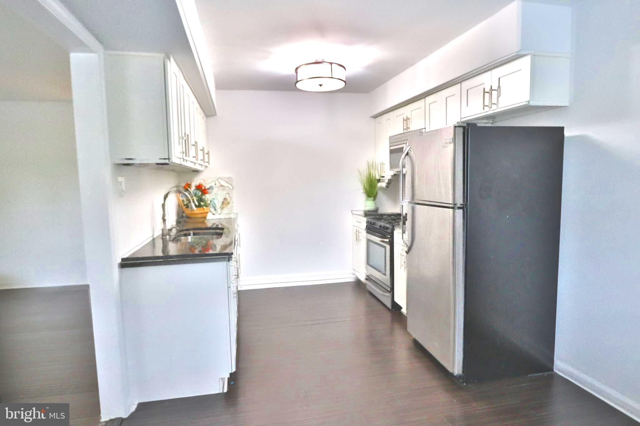 3125 Comly Road Philadelphia, PA 19154 - Photo 8 of 44 a kitchen with stainless steel appliances a refrigerator and a sink