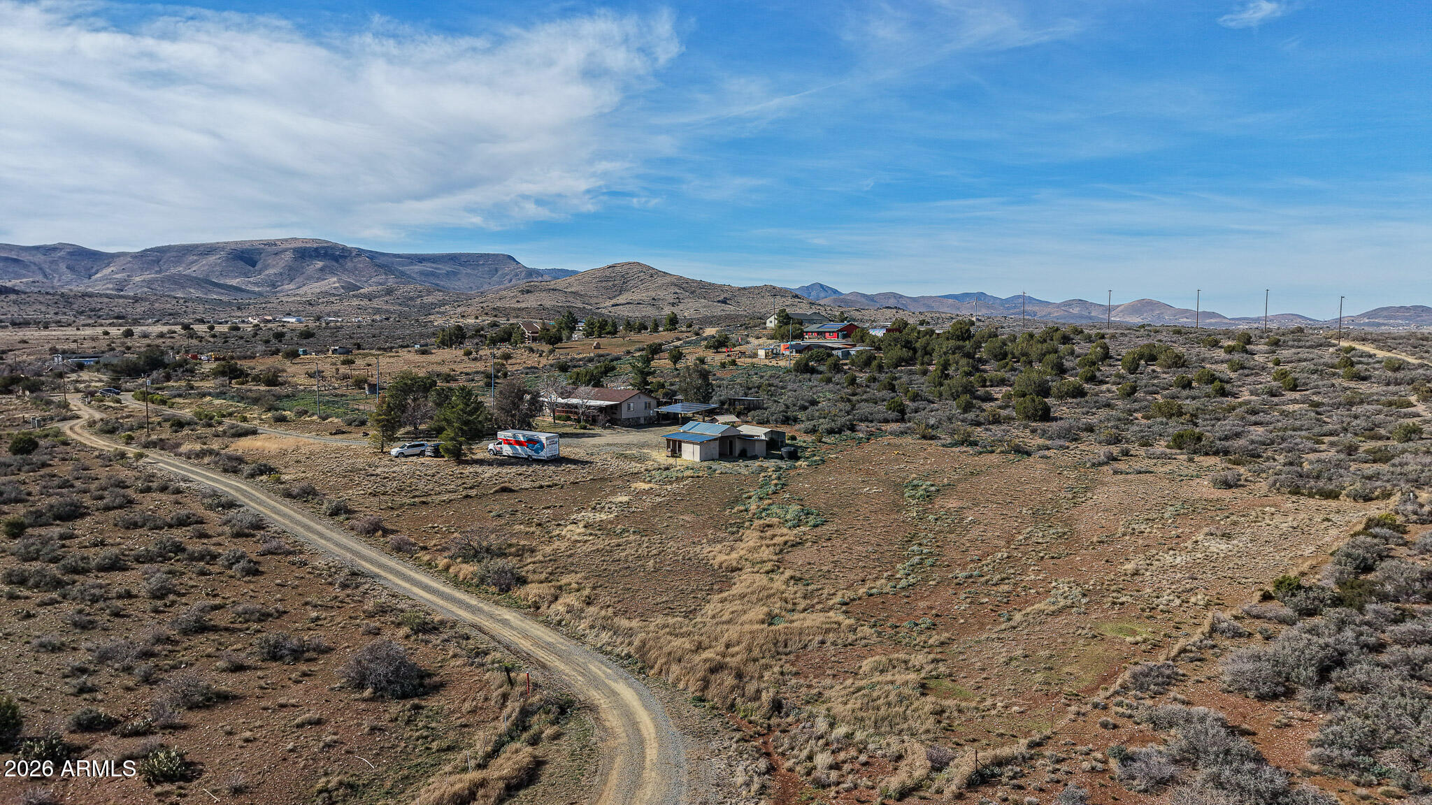 11401 South Hackberry Trail Mayer, AZ 86333 - Photo 11 of 21 a view of a dry yard with mountains in the background