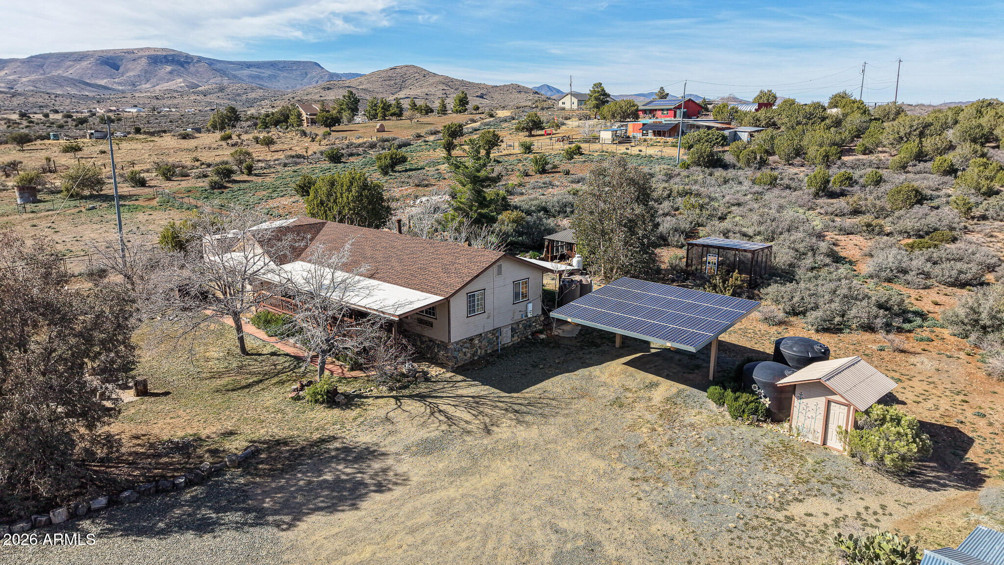 11401 South Hackberry Trail Mayer, AZ 86333 - Photo 16 of 21 an aerial view of a house with a yard and mountain view in back