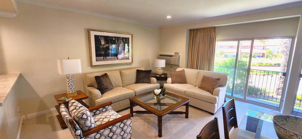 2005 Costa Del Mar Road, Unit 619 Carlsbad, CA 92009 - Photo 15 of 23 a living room with furniture and a window