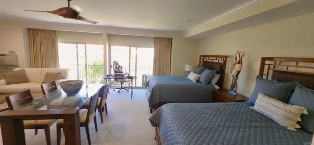 a bedroom with furniture and wooden floor