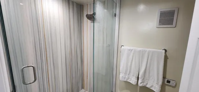 a close view of a sink and shower