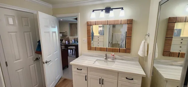 a bathroom with a double vanity sink and mirror