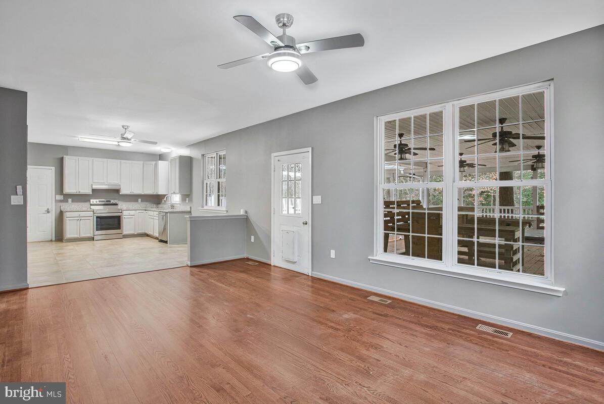 2775 Scientists Cliffs Road Port Republic, MD 20676 - Photo 15 of 54 a view of an empty room with a window and wooden floor