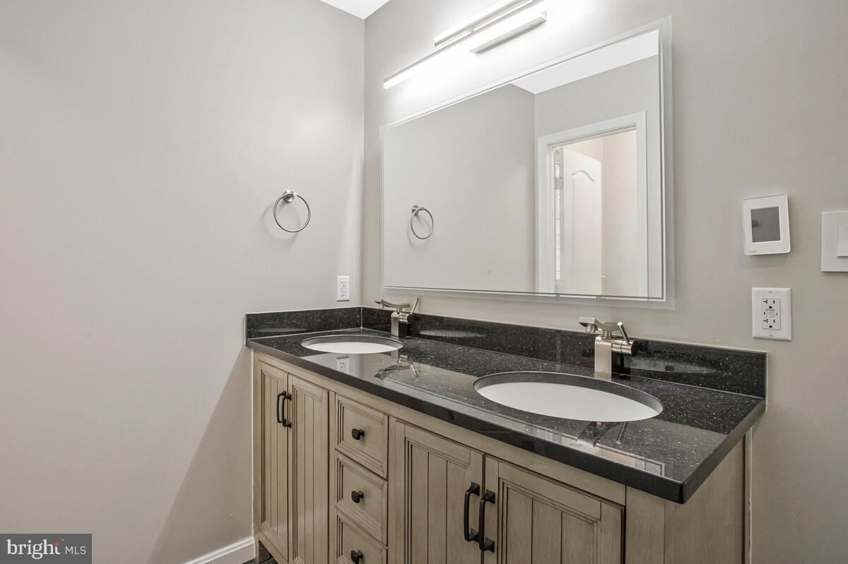 2775 Scientists Cliffs Road Port Republic, MD 20676 - Photo 21 of 54 a sink and a mirror