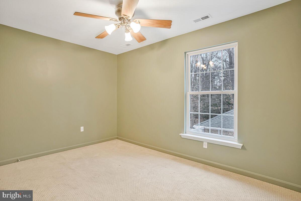 2775 Scientists Cliffs Road Port Republic, MD 20676 - Photo 25 of 54 an empty room with windows and fan