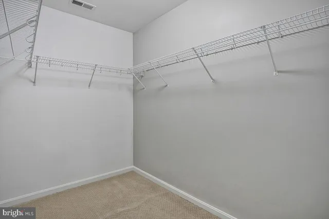 a bathroom with a granite countertop shower and a sink