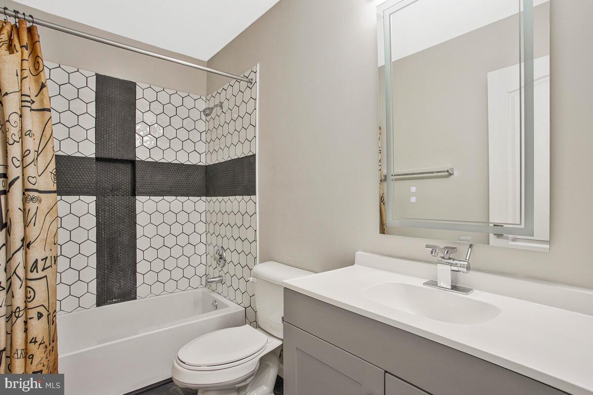 2775 Scientists Cliffs Road Port Republic, MD 20676 - Photo 28 of 54 a bathroom with a sink toilet and shower