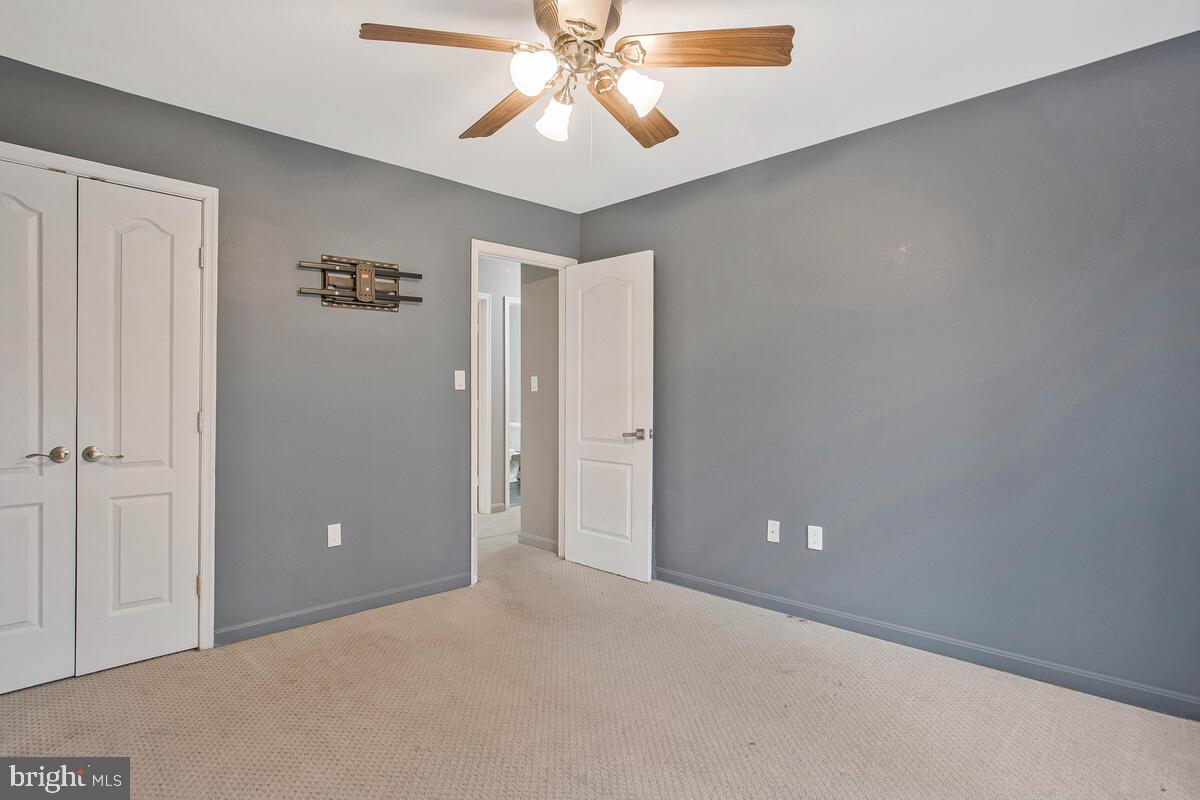 2775 Scientists Cliffs Road Port Republic, MD 20676 - Photo 30 of 54 an empty room with closet and a chandelier fan