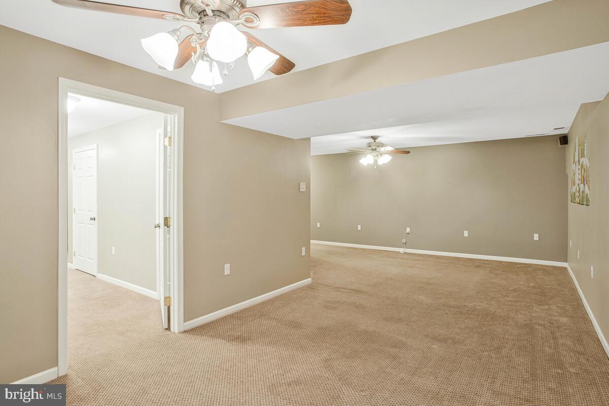 2775 Scientists Cliffs Road Port Republic, MD 20676 - Photo 36 of 54 an empty room with a fan and a fan