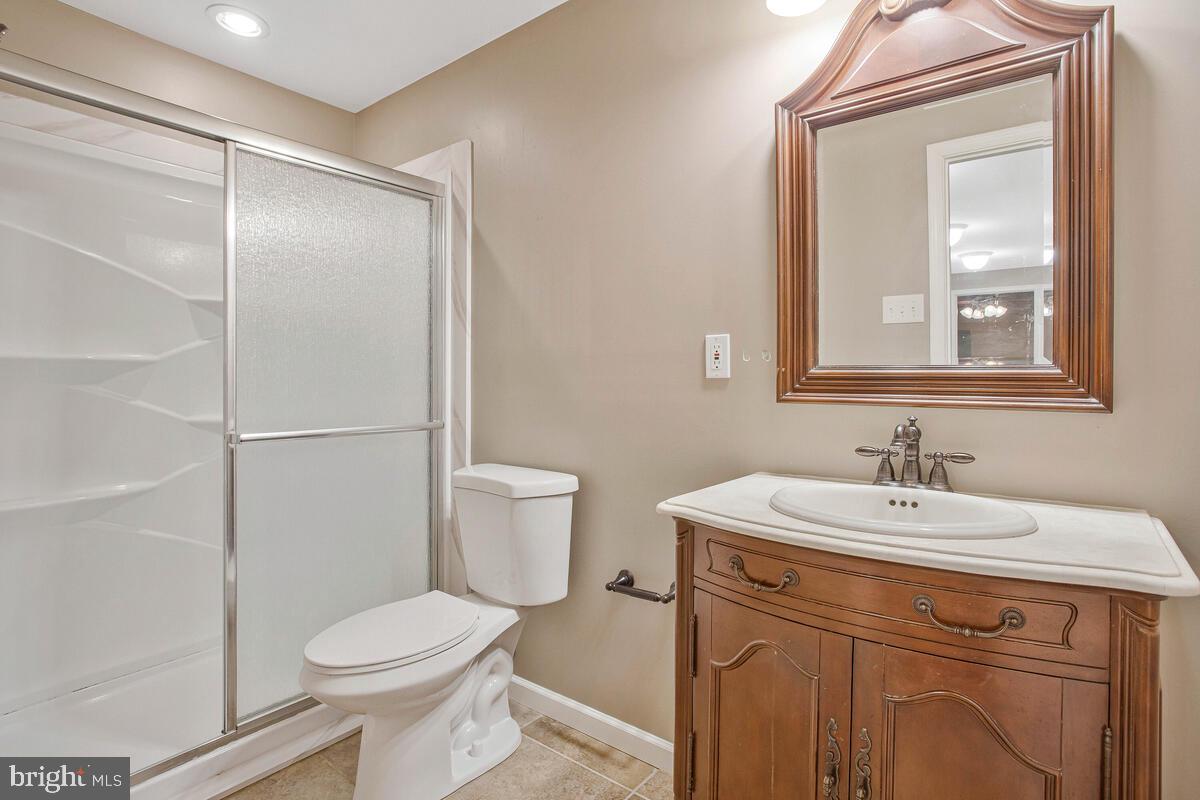 2775 Scientists Cliffs Road Port Republic, MD 20676 - Photo 38 of 54 a bathroom with a sink toilet and vanity