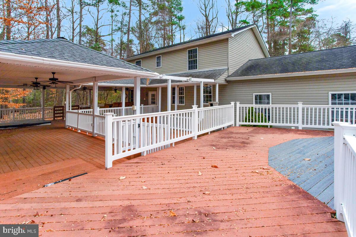 2775 Scientists Cliffs Road Port Republic, MD 20676 - Photo 41 of 54 a view of a house with a wooden deck