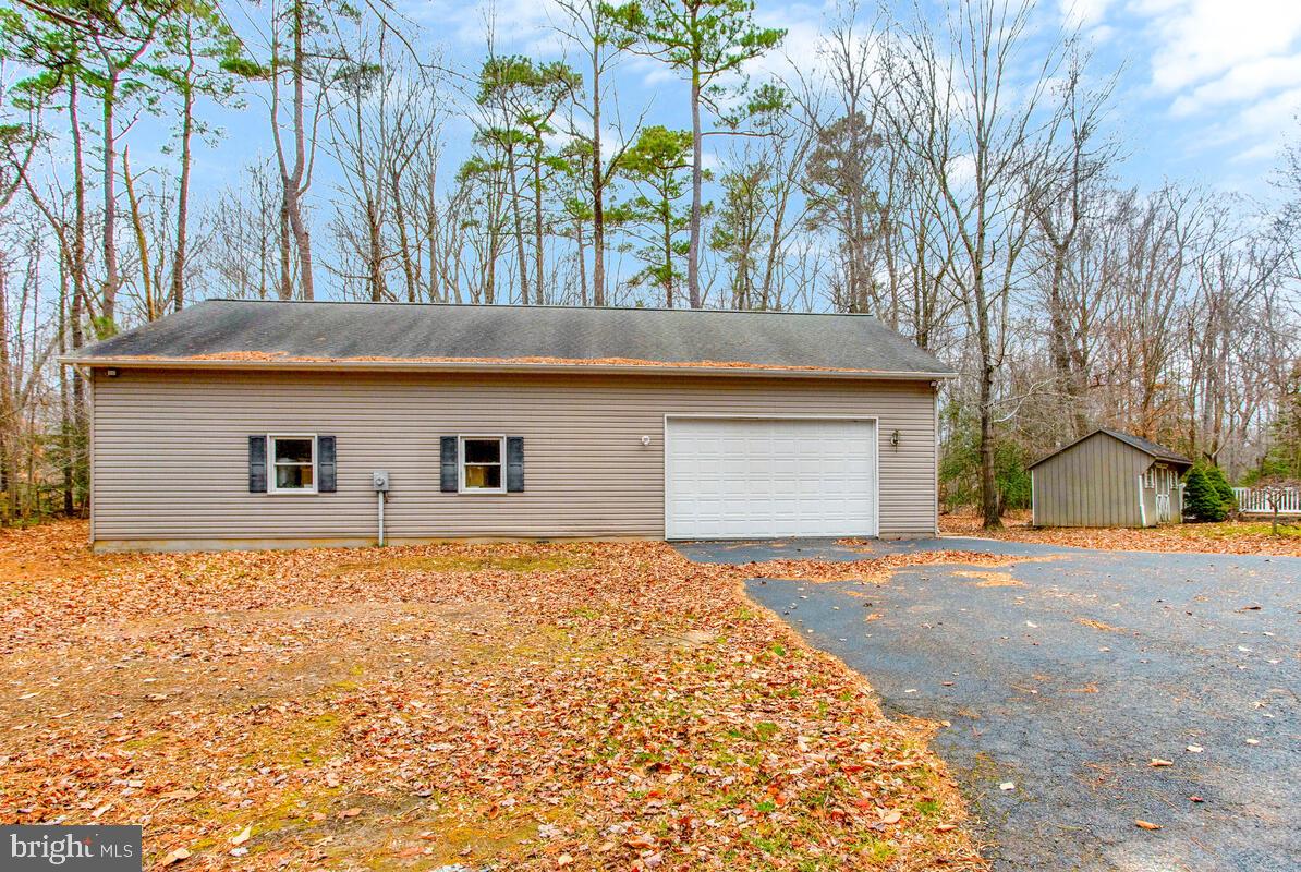2775 Scientists Cliffs Road Port Republic, MD 20676 - Photo 47 of 54 a front view of house with yard