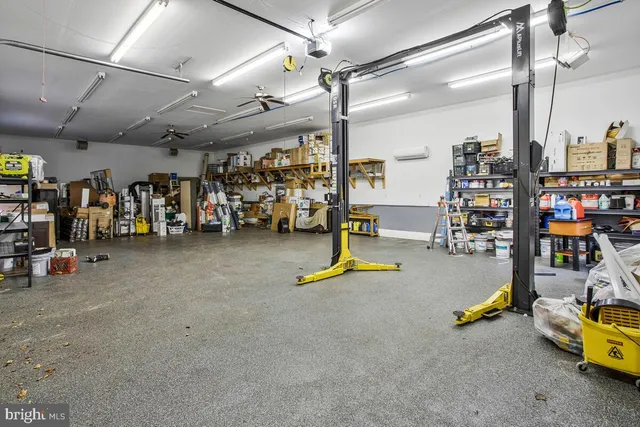 a picture of a bench in front of a gate