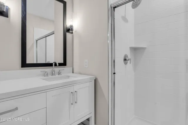 a bathroom with a double vanity sink mirror and double